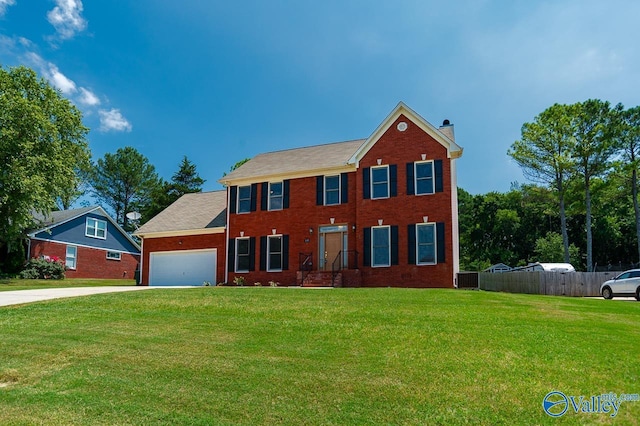 colonial home featuring a garage, central AC unit, and a front yard