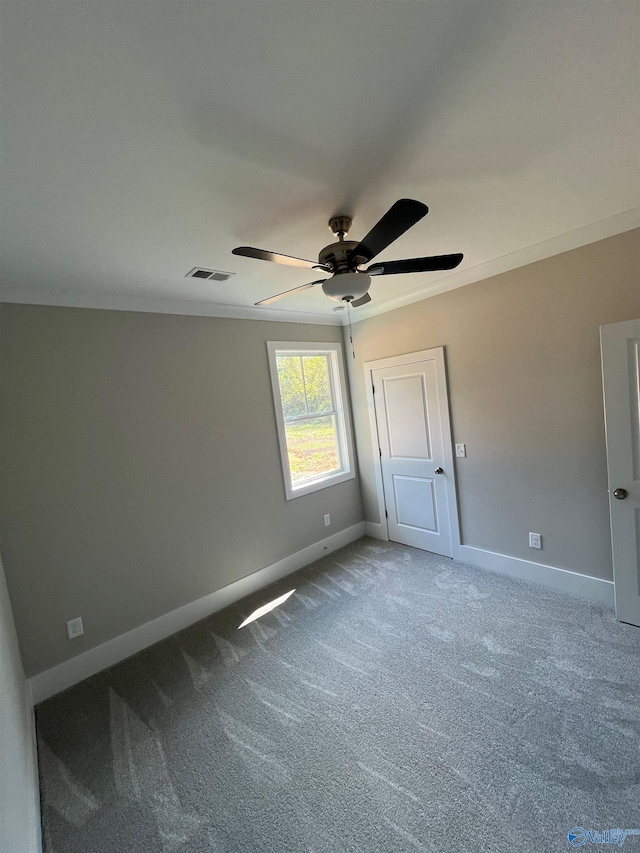 interior space with ceiling fan and carpet flooring