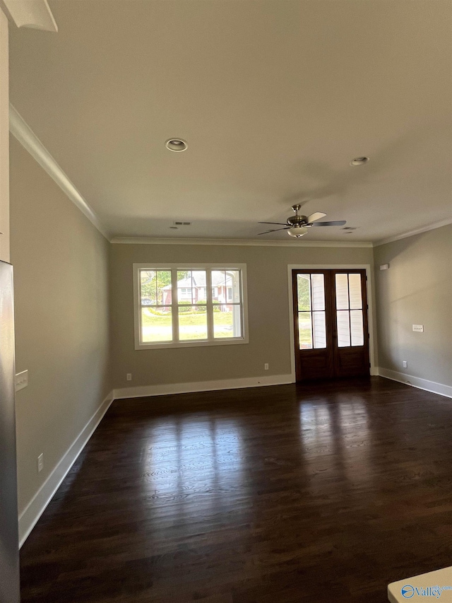 empty room with french doors, ceiling fan, dark hardwood / wood-style floors, and ornamental molding