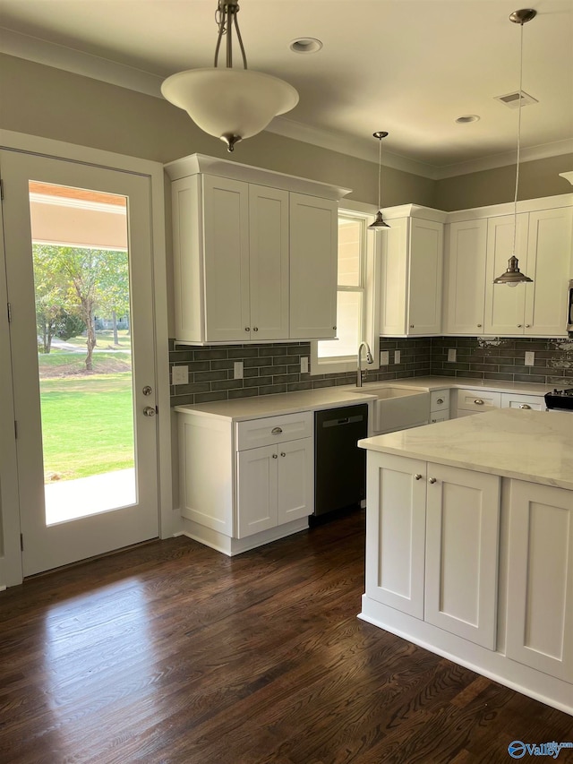 kitchen with hanging light fixtures, dishwasher, dark hardwood / wood-style floors, and tasteful backsplash