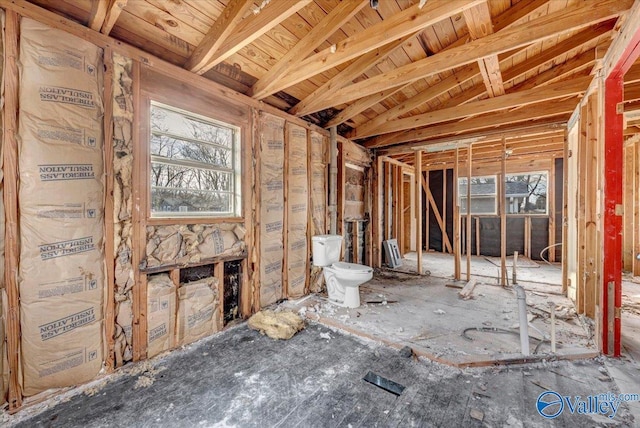 miscellaneous room with beamed ceiling