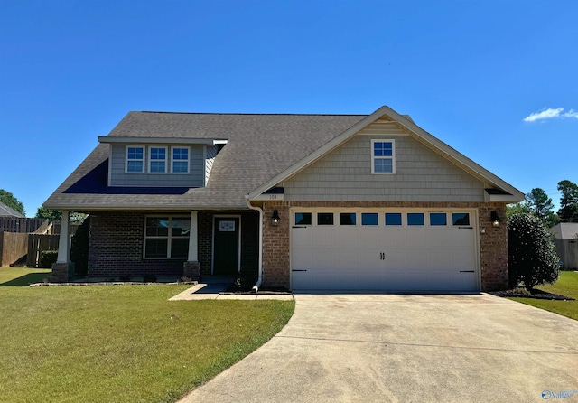 view of front of home featuring a garage and a front lawn