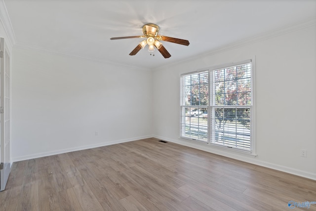 unfurnished room featuring crown molding, light hardwood / wood-style flooring, and ceiling fan