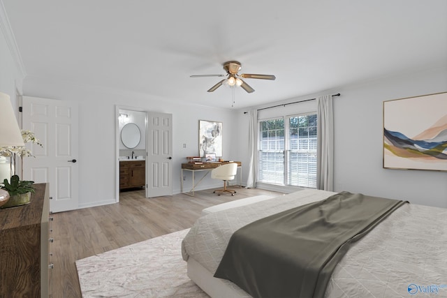 bedroom with sink, ceiling fan, light hardwood / wood-style floors, connected bathroom, and ornamental molding