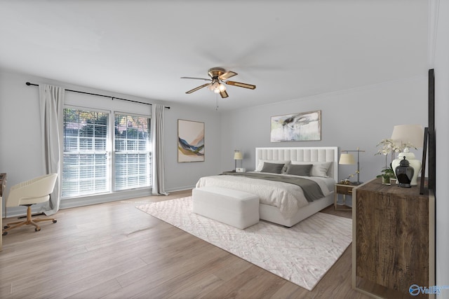 bedroom with hardwood / wood-style floors and ceiling fan