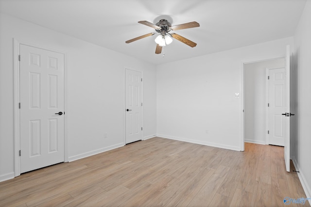 unfurnished bedroom featuring light hardwood / wood-style floors and ceiling fan