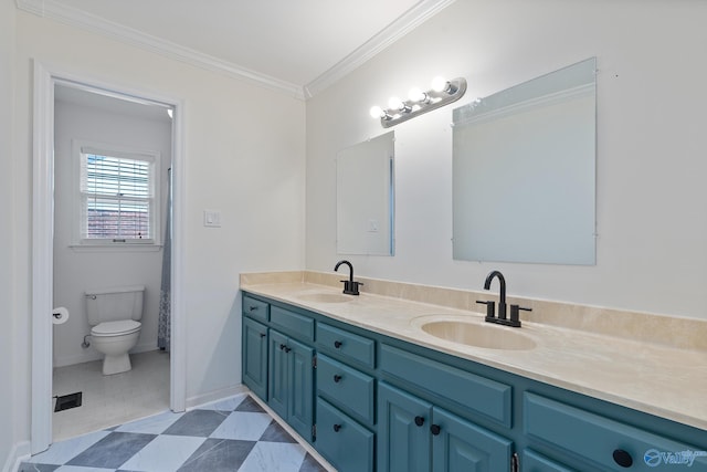 bathroom featuring vanity, ornamental molding, and toilet