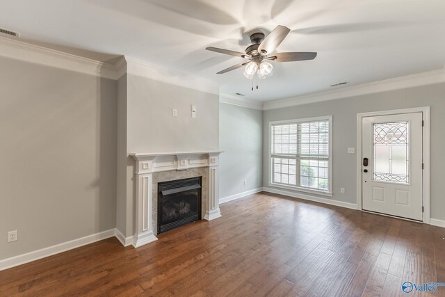 unfurnished living room with a ceiling fan, dark wood-style flooring, and ornamental molding