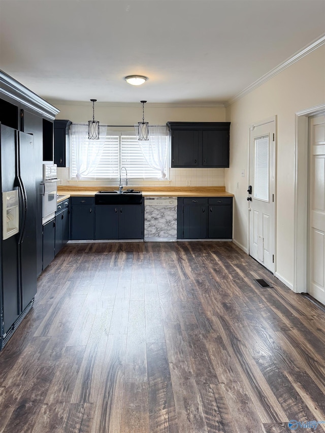 kitchen featuring wood counters, black fridge with ice dispenser, decorative light fixtures, and dark hardwood / wood-style floors