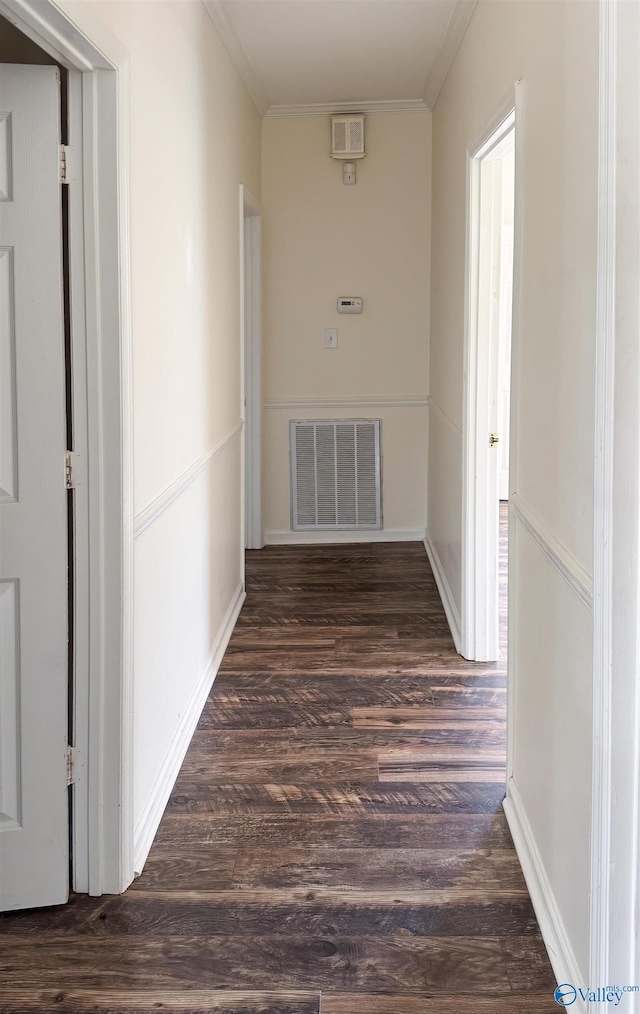 hall featuring crown molding and dark wood-type flooring