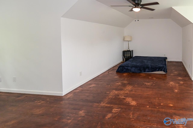 bedroom featuring hardwood / wood-style floors, ceiling fan, and vaulted ceiling