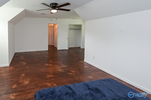 additional living space featuring wood-type flooring, vaulted ceiling, and ceiling fan