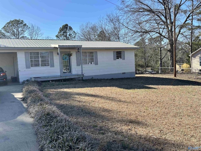 single story home with a front yard, crawl space, metal roof, and fence