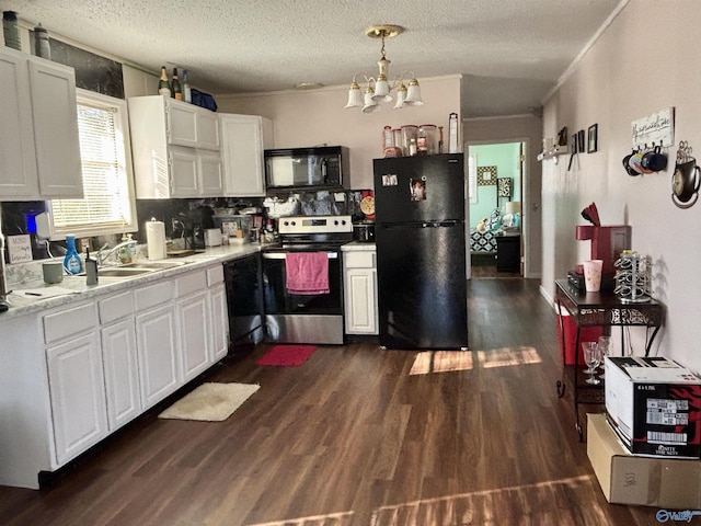 kitchen featuring dark wood-type flooring, white cabinetry, a sink, and black appliances