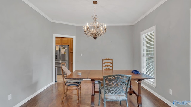 11266 Maggie Lou Dr, Tanner, AL 35671 - dining room with a chandelier, healthy amount of natural light, crown molding, and dark wood finished floors