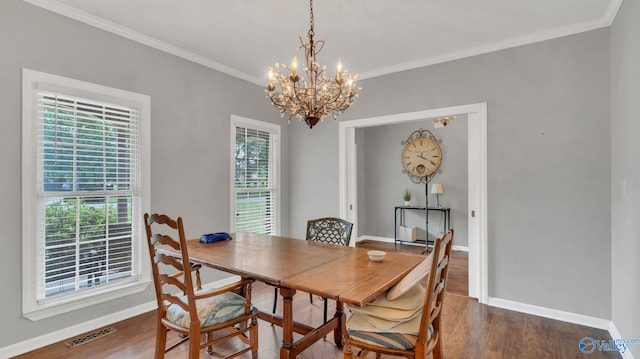 11266 Maggie Lou Dr, Tanner, AL 35671 - dining room with a chandelier, baseboards, wood finished floors, and crown molding