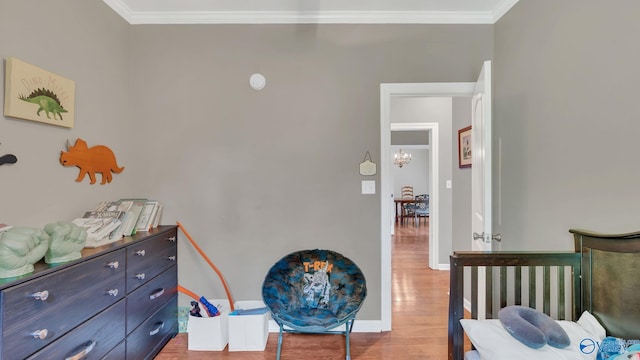 11266 Maggie Lou Dr, Tanner, AL 35671 - bedroom with wood finished floors, ornamental molding, a chandelier, and baseboards