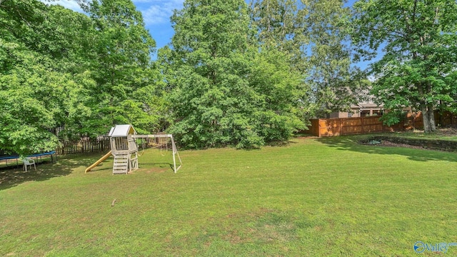 11266 Maggie Lou Dr, Tanner, AL 35671 - view of yard featuring a trampoline and a playground