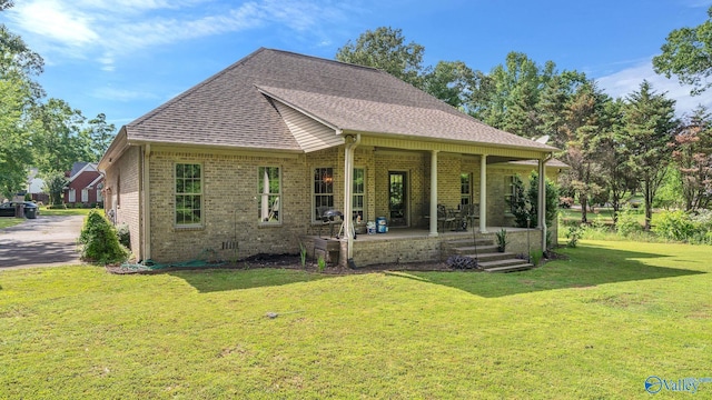 11266 Maggie Lou Dr, Tanner, AL 35671 - view of front of property with brick siding, a front yard, and a shingled roof