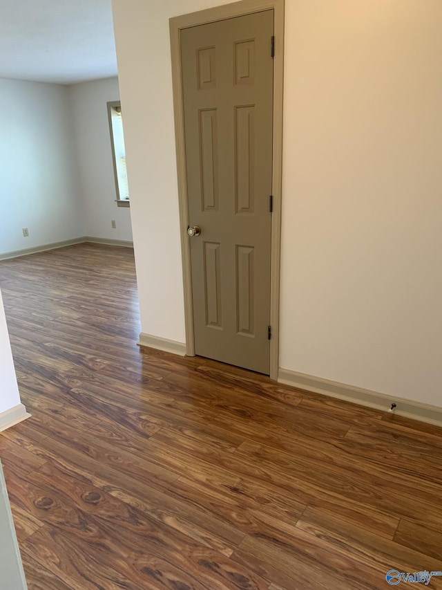 empty room featuring dark hardwood / wood-style floors