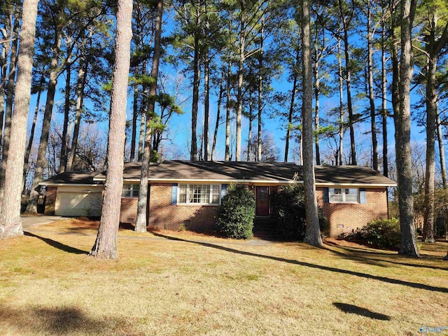 single story home with a garage and a front yard