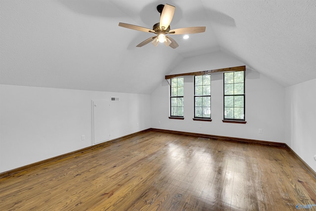 17207 County Road 22, Centre, AL 35960 - bonus room featuring hardwood / wood-style floors, lofted ceiling, ceiling fan, baseboards, and a textured ceiling