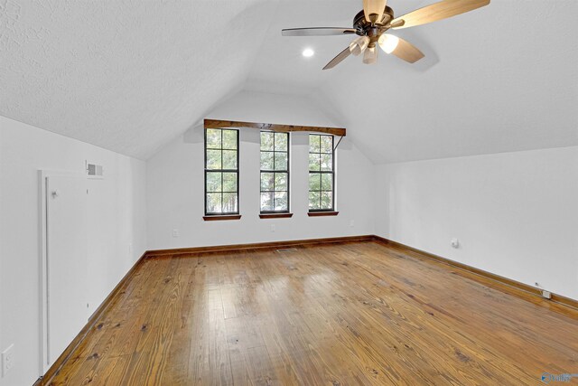 17207 County Road 22, Centre, AL 35960 - bonus room featuring lofted ceiling, wood-type flooring, baseboards, a textured ceiling, and a ceiling fan