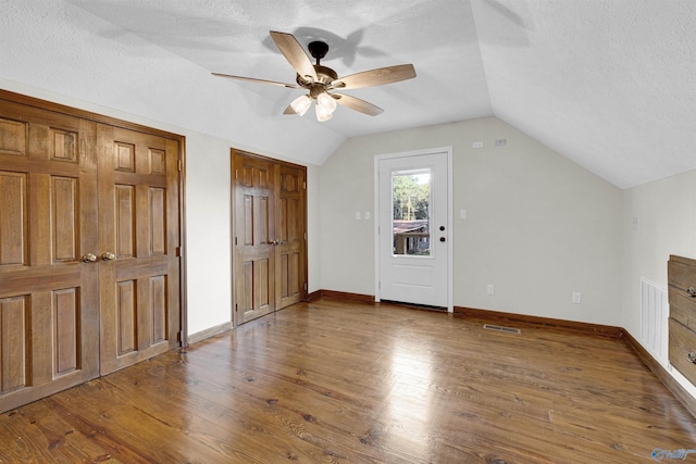 17207 County Road 22, Centre, AL 35960 - additional living space featuring ceiling fan, lofted ceiling, wood finished floors, a textured ceiling, and baseboards