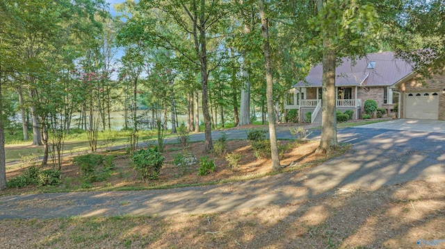 17207 County Road 22, Centre, AL 35960 - view of yard with covered porch, concrete driveway, and a garage