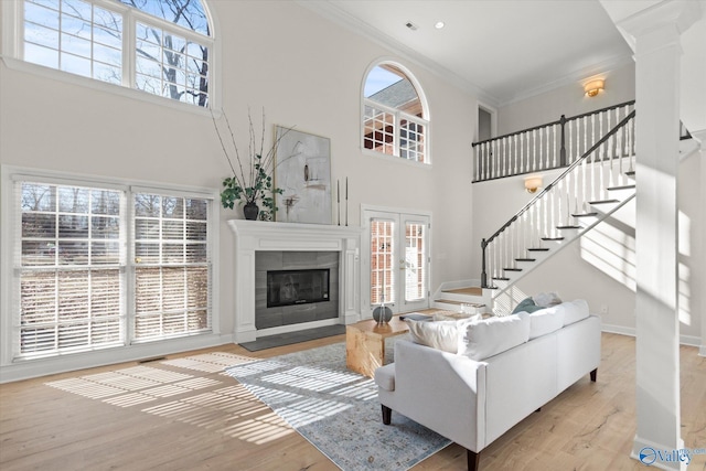 living room with a healthy amount of sunlight and ornamental molding