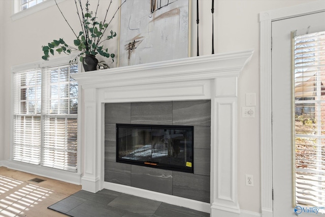 room details featuring a tiled fireplace