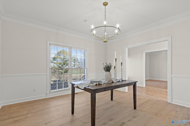 home office featuring crown molding, light hardwood / wood-style floors, and a notable chandelier