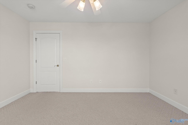 empty room featuring carpet and ceiling fan