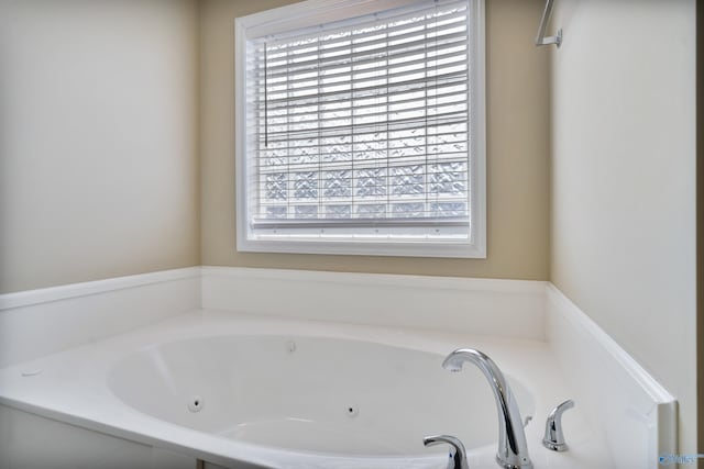 bathroom featuring a tub to relax in