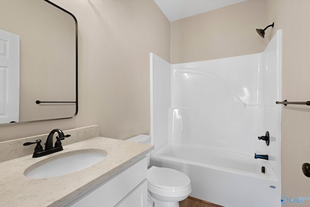 bathroom featuring vanity, toilet, and tub / shower combination