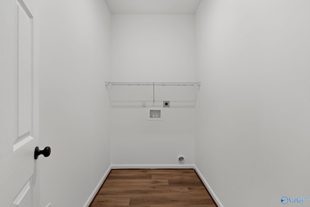 washroom with baseboards, washer hookup, laundry area, wood finished floors, and electric dryer hookup