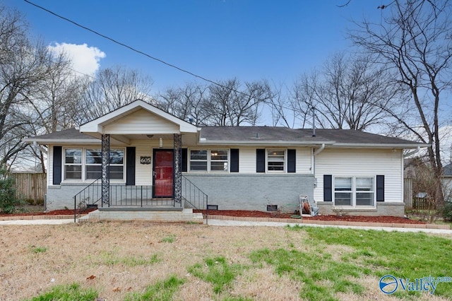 single story home featuring brick siding and crawl space