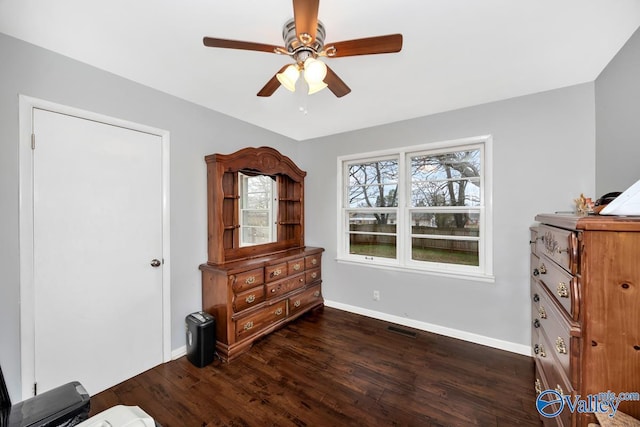 bedroom with visible vents, baseboards, ceiling fan, and dark wood-style flooring