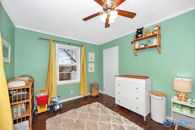 game room with ceiling fan, wood finished floors, baseboards, and ornamental molding