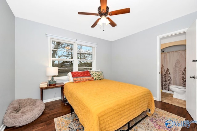 bedroom featuring a ceiling fan, baseboards, and wood finished floors