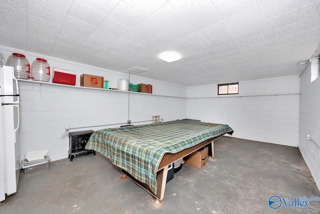 interior space with concrete floors and concrete block wall