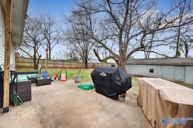 view of patio / terrace with a grill, outdoor lounge area, and a fenced backyard