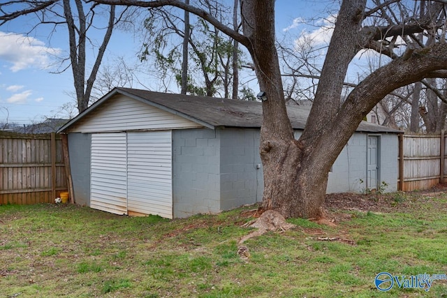 view of outbuilding with an outbuilding and fence