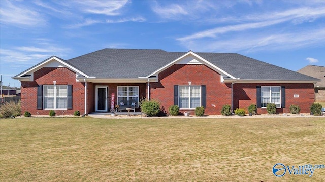 ranch-style home featuring a front yard