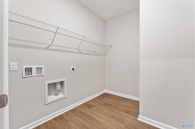 34 Aurora Cir, Fayetteville, TN 37334 - laundry room featuring hookup for an electric dryer, wood finished floors, baseboards, and washer hookup