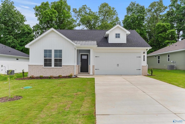34 Aurora Cir, Fayetteville, TN 37334 - view of front of property featuring brick siding, cooling unit, an attached garage, a front yard, and board and batten siding