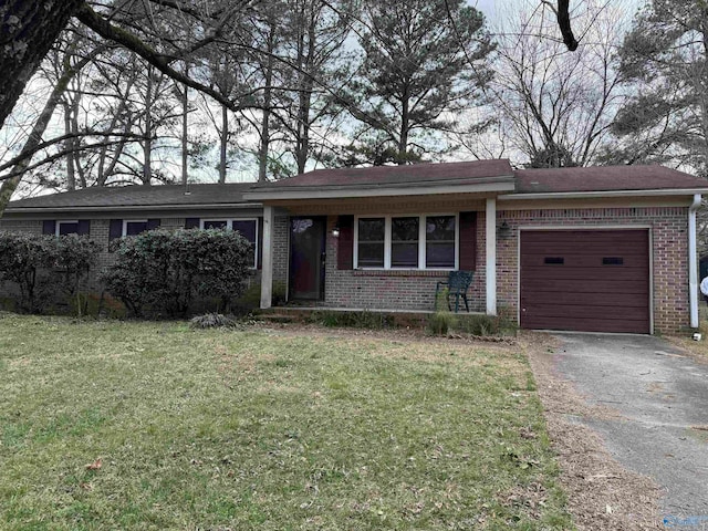 single story home with a garage and a front lawn