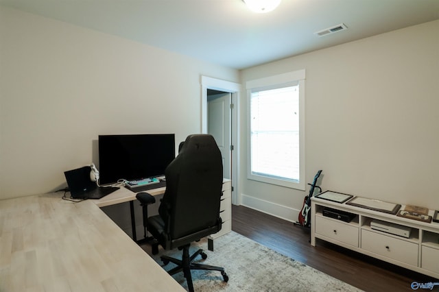 office with dark hardwood / wood-style floors