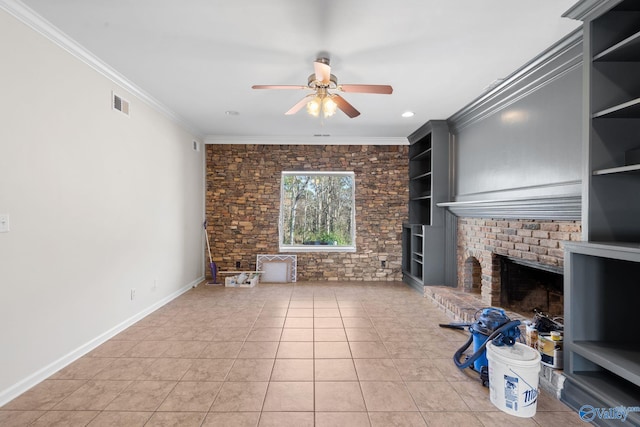unfurnished living room with crown molding, a brick fireplace, visible vents, and built in features