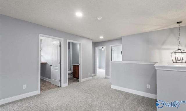 spare room with light colored carpet